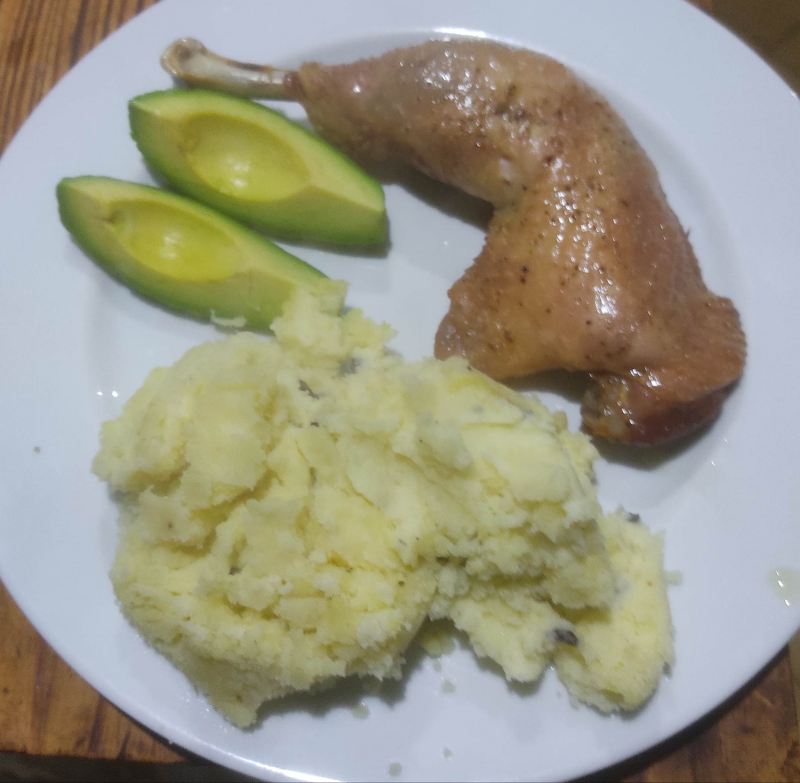 Roast chicken leg with avocado and truffle mash